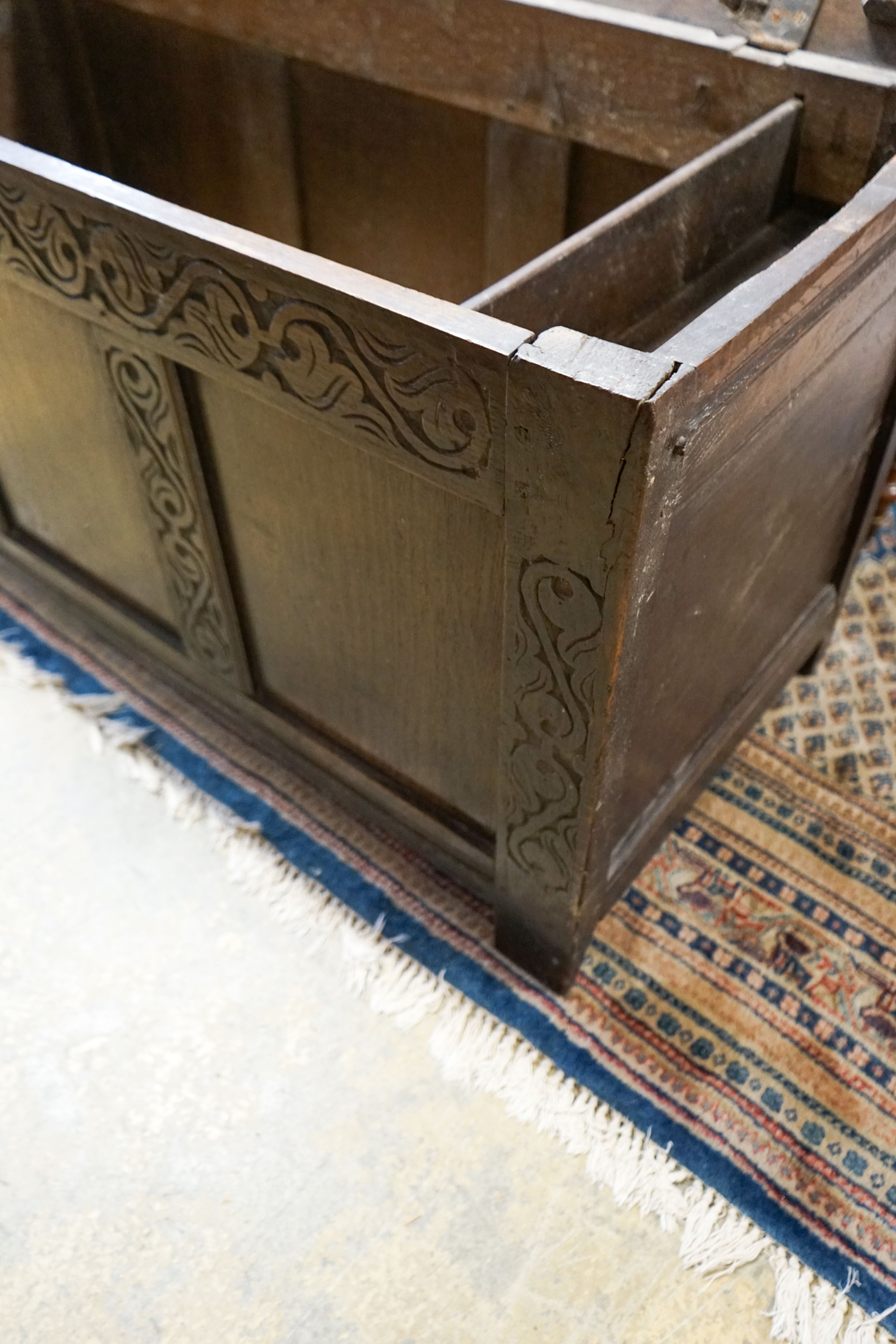 A late 17th / early 18th century carved and panelled oak coffer, length 136cm, depth 58cm, height 66cm